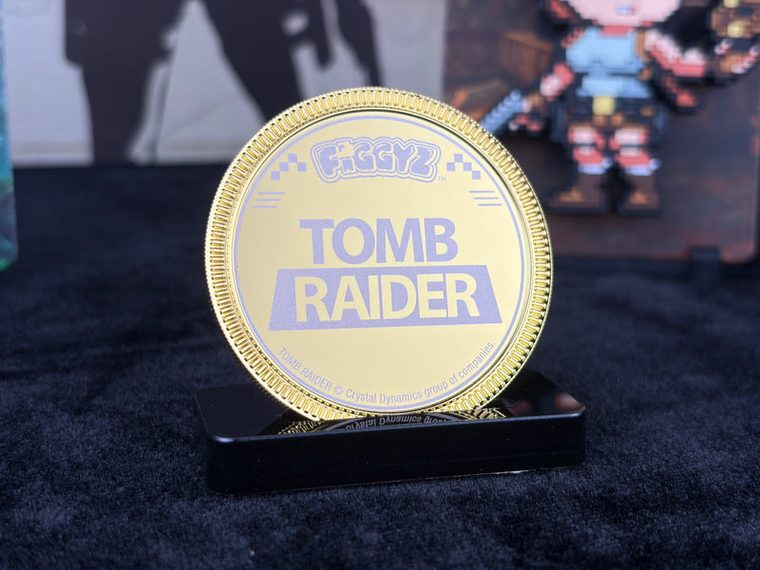 The numbered commemorative coin on its display stand