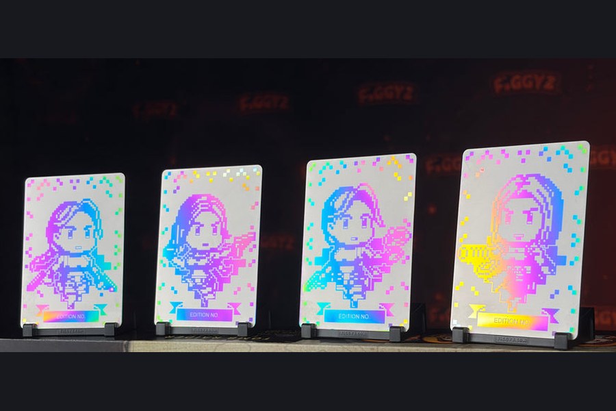 All four box-set-exclusive holo plates in a row, each printed with its edition number