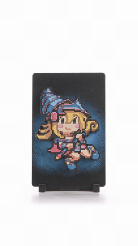Dark Magician Girl FiGGYZ turning on its display stand, showing the figure, its themed backplate and the base